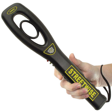 A hand holding a black Streetwise Finger Grip Metal Detector w/ Belt Loop Holster
