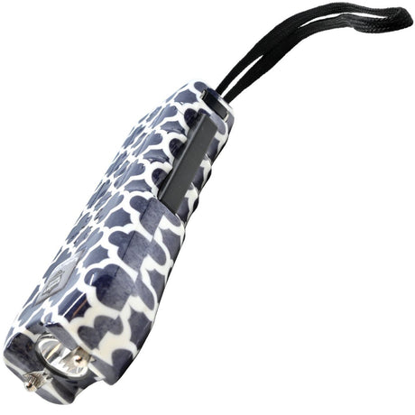 a view of the dark blue and white geometric patterned Streetwise™ Ladies' Choice LED Stun Gun Alarm with its metal prongs and its squeeze-n-stun feature and keychain strap.