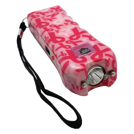 a top angle view of the Pink Street Wise Ladies' Choice stun gun in a pink ribbon pattern and a wrist lanyard showing the flashlight at the end