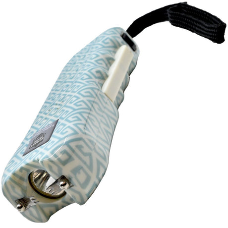 a top view of a teal and white Streetwise™ Ladies' Choice LED Stun Gun Alarm with geometric patterns, showing its prongs and its squeeze-n-stun feature with its keychain strap.
