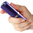 a hand holding a violet Streetwise™ Perfume Protector Disguised Rechargeable Stun Gun 17M