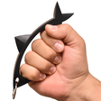 A hand gripping a black Streetwise SHAR-KEY Self Defense Keychain Weapon