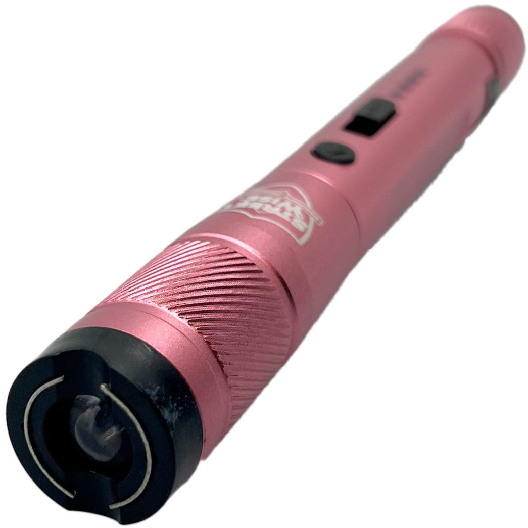 a close up view of a pink streetwise streetlight LED flashlight showcasing its metal prongs.