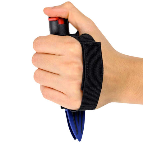 a blue Streetwise™ Strike-n-Spray Double Defender Pepper spray with its jogging strap wrapped around the hand.