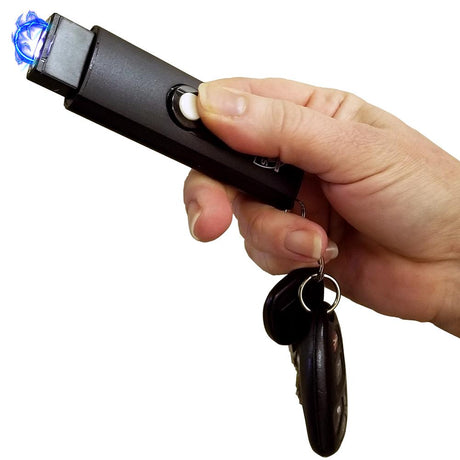 a hand holding the USB stun gun that is part of the Stun Gun & Pepper Spray Self-Defense Keychain Weapon Set