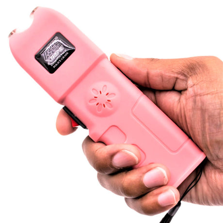 a hand holding a pink Tiger-USA Xtreme Sanctuary LED Alarm Stun Gun 150M