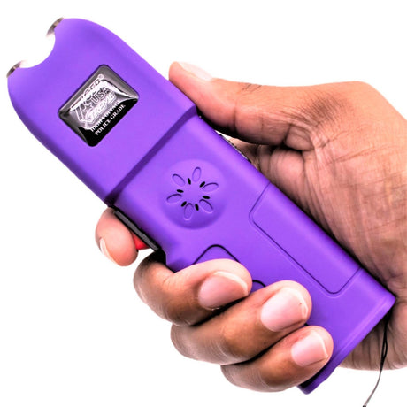 a hand holding a purple Tiger-USA Xtreme Sanctuary LED Alarm Stun Gun 
