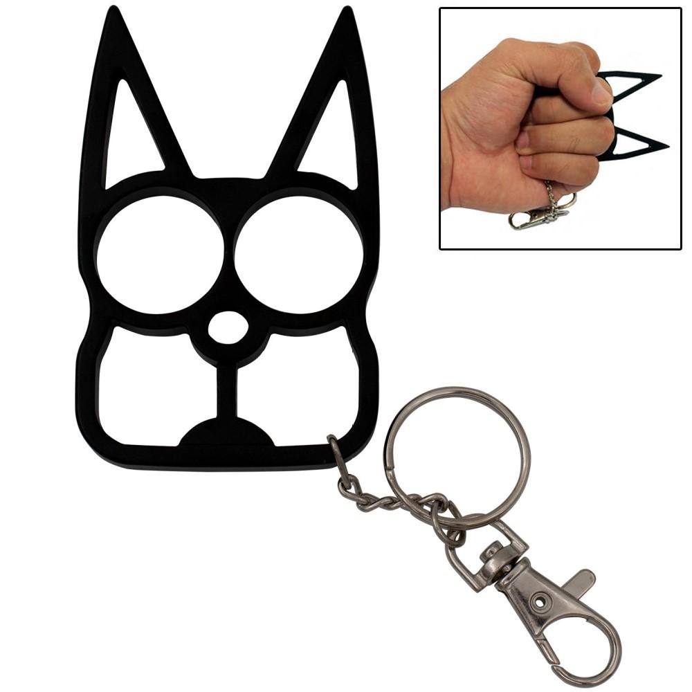 a black WeaponTek Cat Keychain Self-Defense Metal Knuckle Weapon with a picture of a hand gripping it by the top right corner