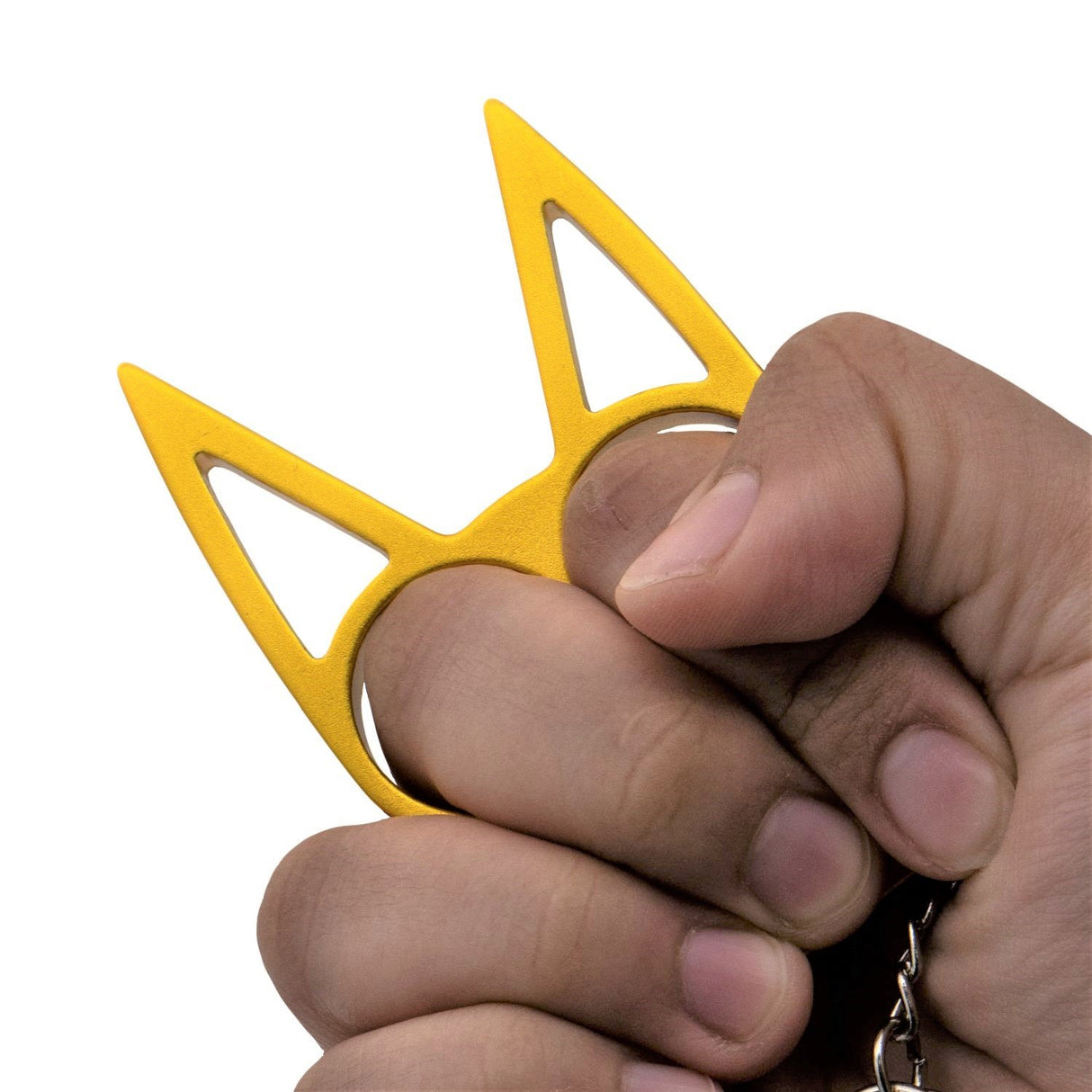 a hand gripping a gold WeaponTek™ Cat Keychain Self-Defense Metal Knuckle Weapon