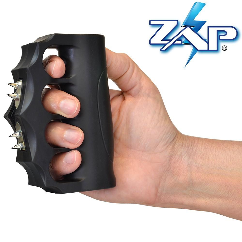 a hand gripping a ZAP Blast Knuckles Stun Gun Extreme w/ Holster 950K
