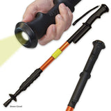 a hand holding a ZAP Hike 'n Strike™ LED Stun Gun Staff to use its light