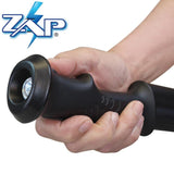 a hand holding aZAP Hike 'n Strike™ LED Stun Gun Staff using the LED light by the handle