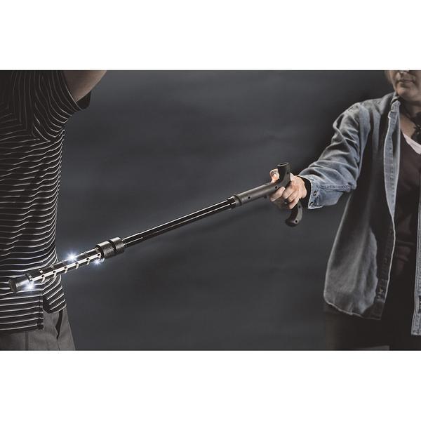 a person using the ZAP Rechargeable LED Stun Gun Walking Cane to tase someone
